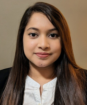 image of Syeda Jahirin Aktari dressed in business casual clothing looking at the camera